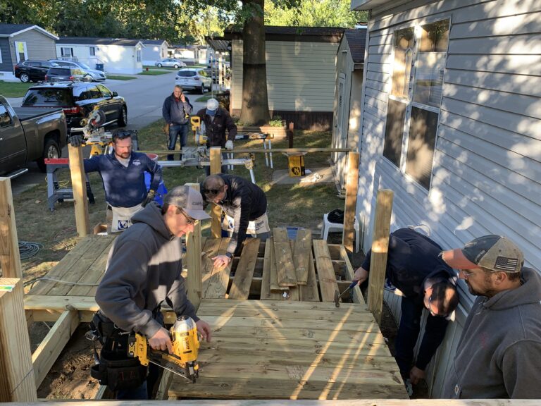 Volunteers Groups Aid Us in the Construction of a Home Accessibility Ramp.